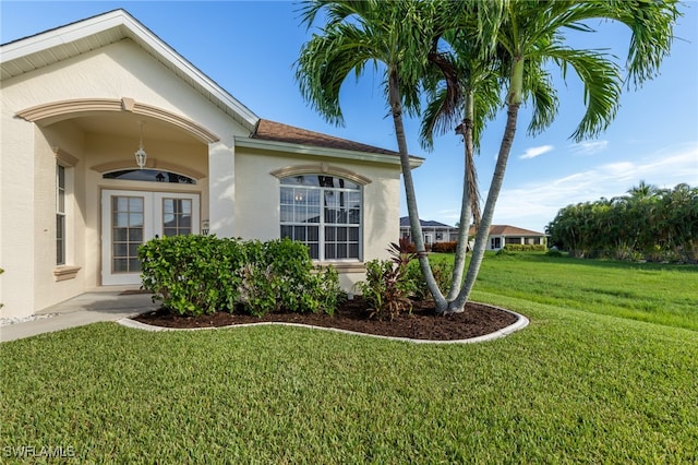 view of side of home featuring a lawn