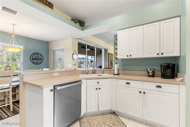 kitchen featuring light tile patterned flooring, sink, kitchen peninsula, white cabinetry, and dishwasher