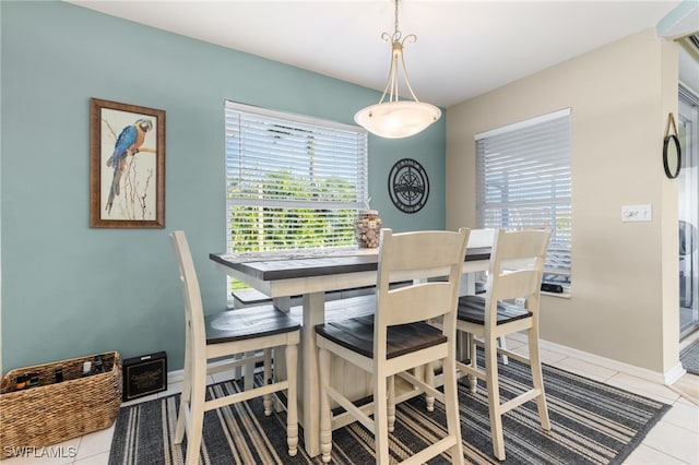 tiled dining area with a wealth of natural light