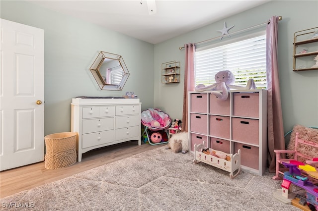 rec room featuring light hardwood / wood-style floors