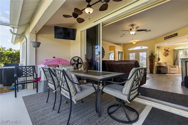 view of patio / terrace featuring ceiling fan and french doors