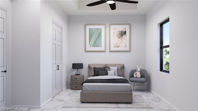 living area with ceiling fan and light tile patterned floors