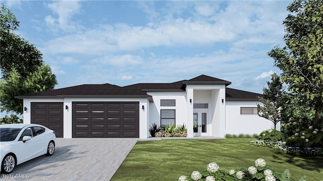 view of front of property with a garage and a front yard