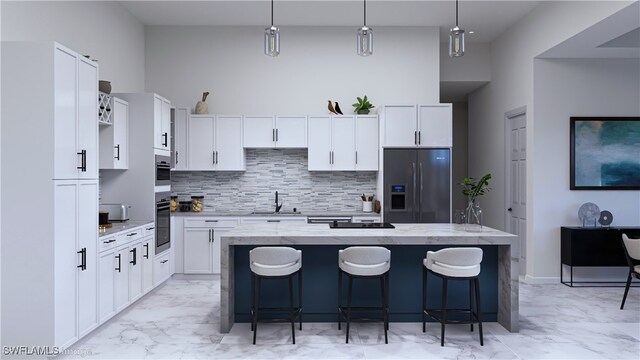 kitchen featuring a breakfast bar area, sink, stainless steel refrigerator with ice dispenser, and a center island