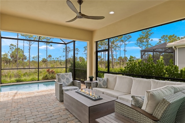 sunroom / solarium with ceiling fan