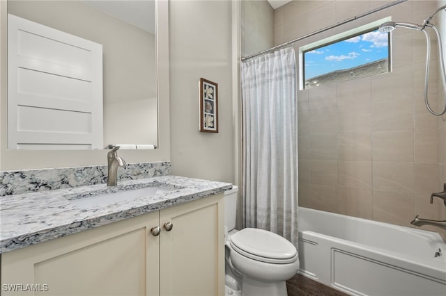 full bathroom featuring shower / bathtub combination with curtain, vanity, and toilet