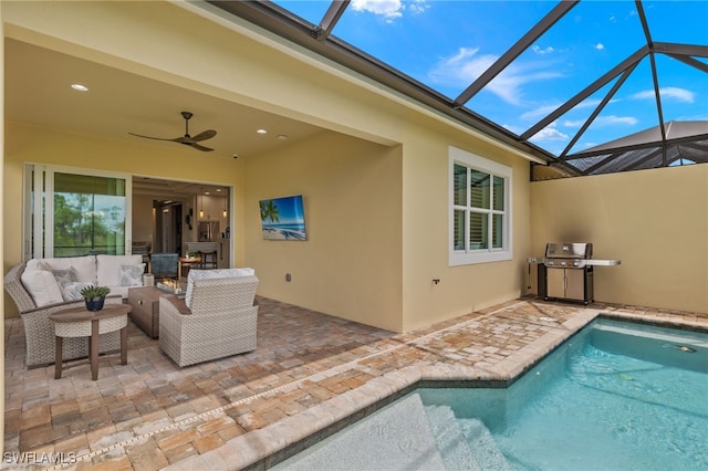 view of pool with outdoor lounge area, a patio, area for grilling, and a lanai