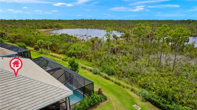 birds eye view of property with a water view