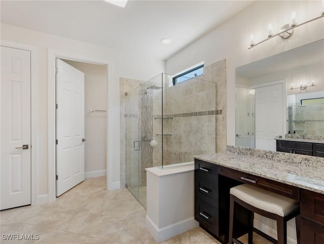 bathroom featuring vanity and walk in shower