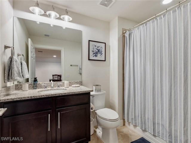 full bathroom featuring vanity, shower / tub combo, and toilet