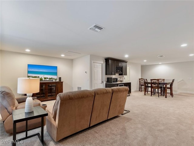 living room featuring light colored carpet