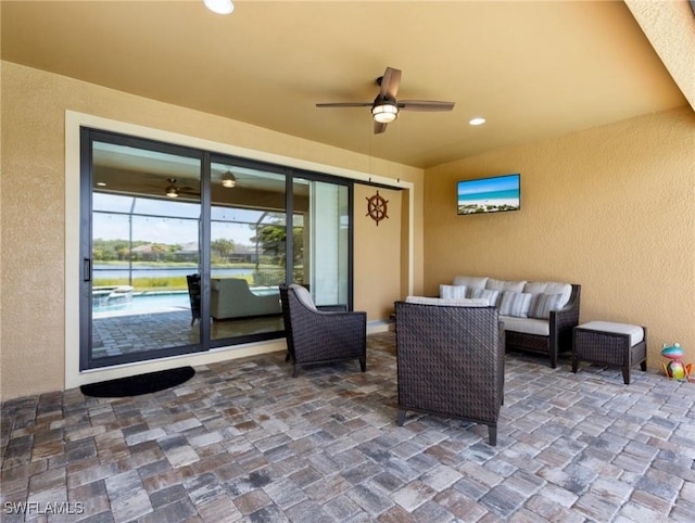 view of patio with outdoor lounge area and ceiling fan