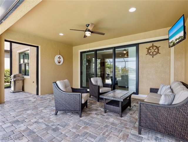 view of patio / terrace featuring ceiling fan, grilling area, and an outdoor hangout area