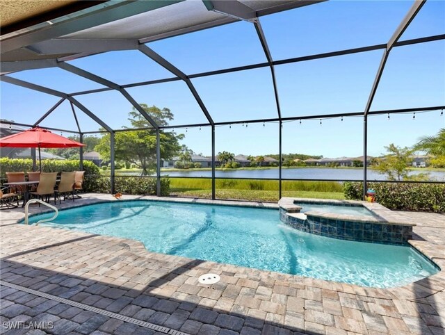 view of pool featuring a water view, an in ground hot tub, a lanai, and a patio