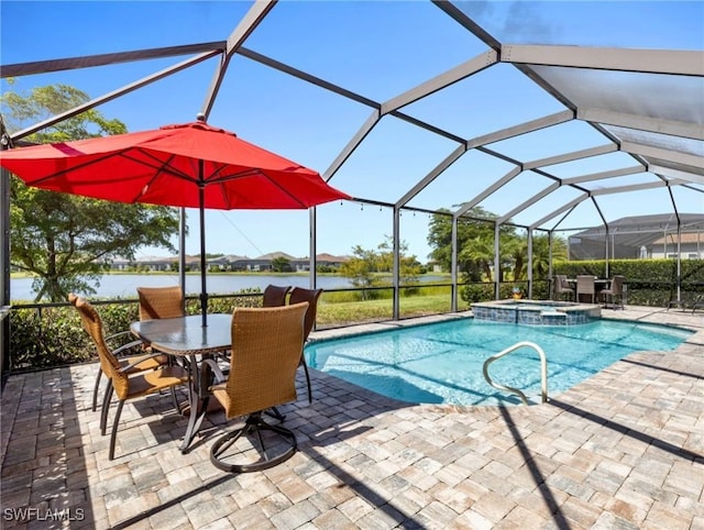 view of pool with a water view, a patio, an in ground hot tub, and glass enclosure