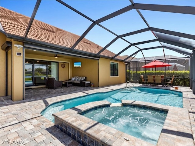 view of pool featuring an outdoor living space, a lanai, a patio area, and an in ground hot tub