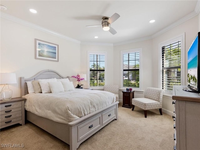 carpeted bedroom featuring crown molding and ceiling fan