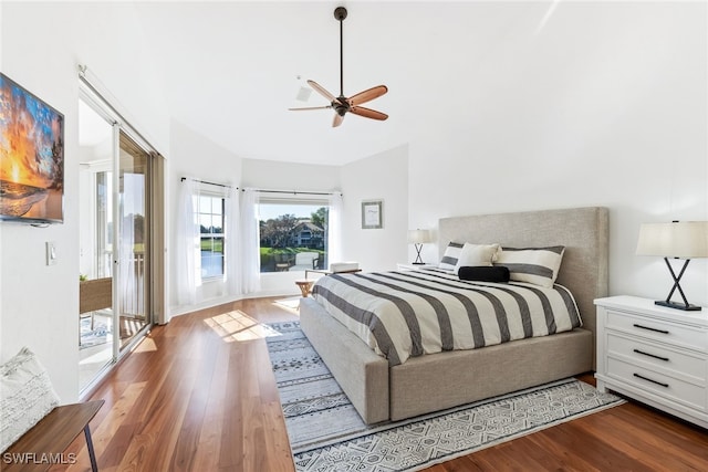 bedroom with access to exterior, a ceiling fan, and wood finished floors