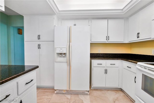 kitchen featuring dark stone countertops, white cabinetry, crown molding, and white appliances