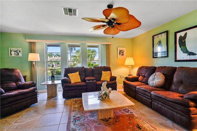 tiled living room with ceiling fan