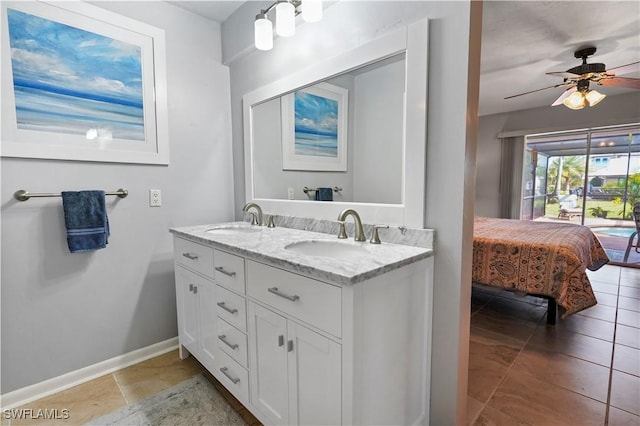 bathroom featuring tile patterned floors, ceiling fan, and vanity