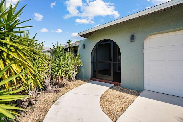 doorway to property featuring a garage