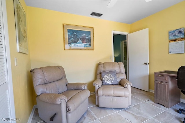 sitting room with light tile patterned floors