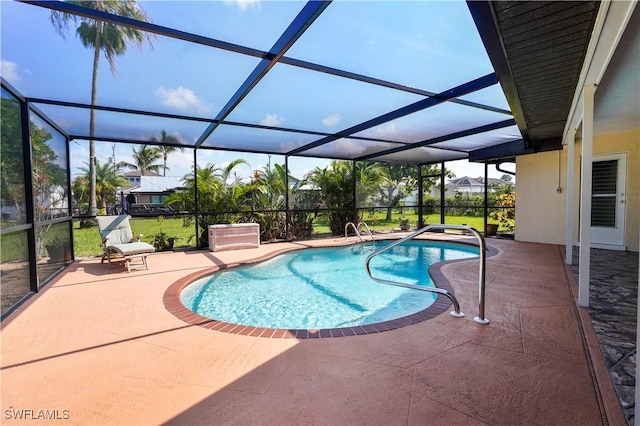 view of swimming pool featuring a lanai and a patio area