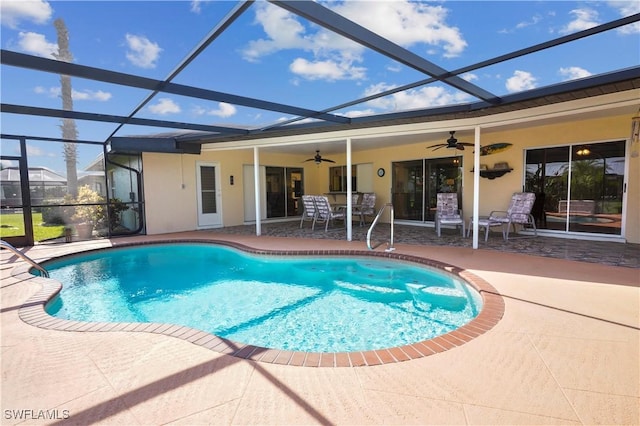 view of swimming pool featuring a lanai, a patio area, and ceiling fan