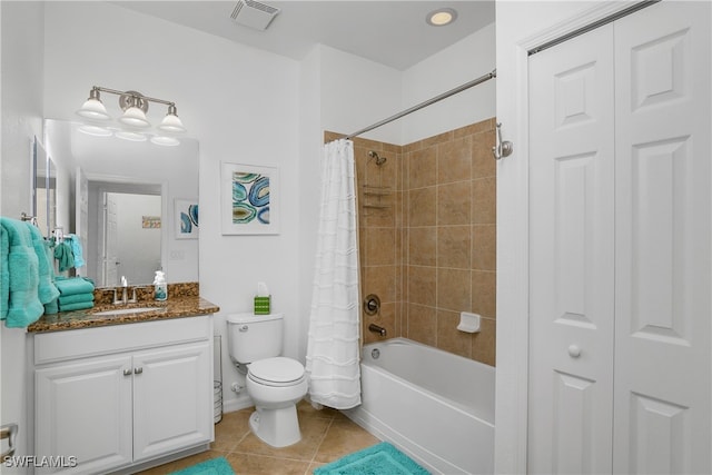 full bathroom featuring tile patterned flooring, vanity, shower / bath combination with curtain, and toilet