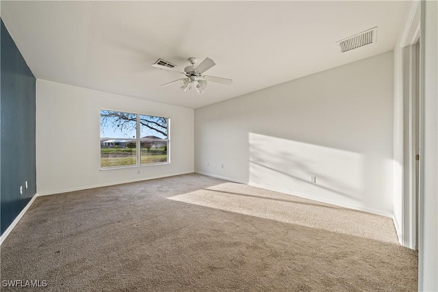 unfurnished room featuring ceiling fan and carpet flooring