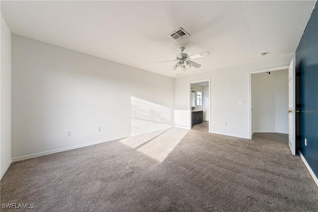 unfurnished room featuring ceiling fan and light carpet