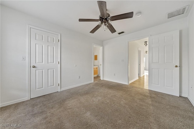 unfurnished bedroom featuring ceiling fan and light carpet