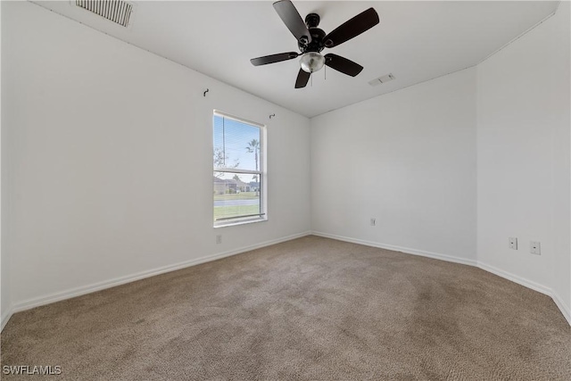 spare room with ceiling fan and carpet floors