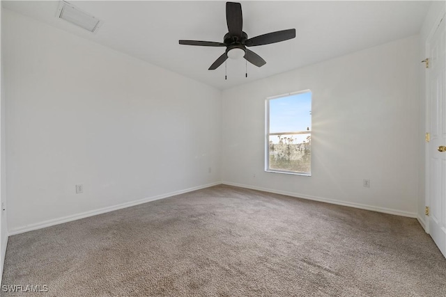 carpeted empty room featuring ceiling fan