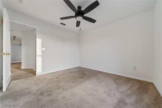 carpeted empty room with ceiling fan