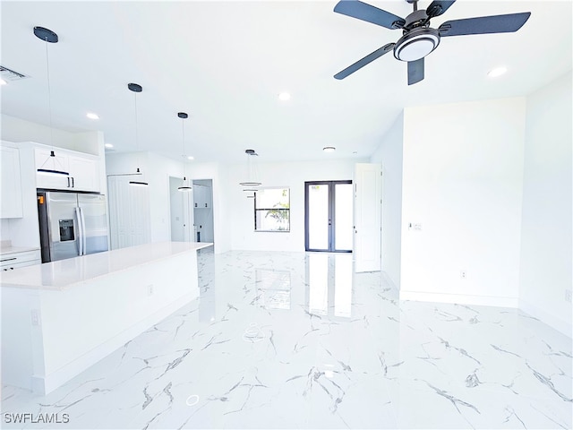 kitchen with stainless steel fridge with ice dispenser, light tile patterned floors, pendant lighting, and ceiling fan