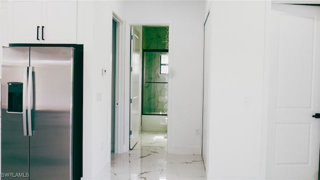 hall with light tile patterned flooring