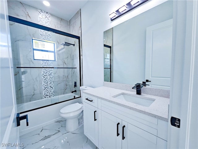 full bathroom with tile patterned flooring, toilet, combined bath / shower with glass door, and vanity