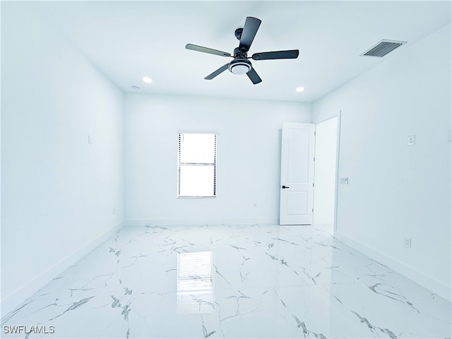 unfurnished room with ceiling fan and tile patterned floors