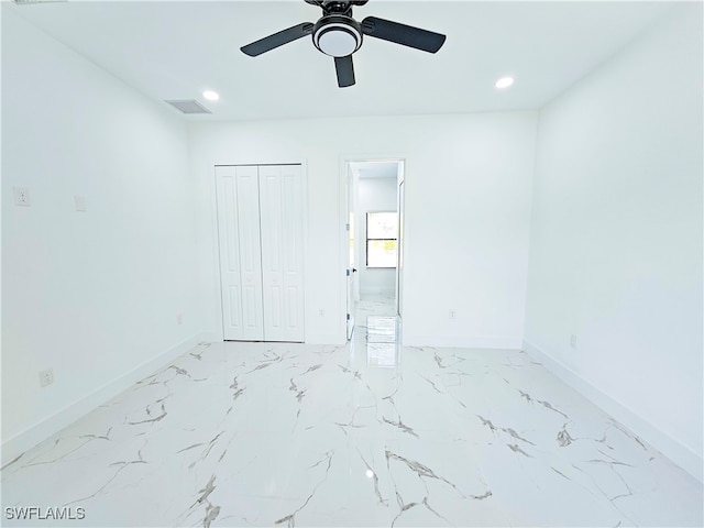 unfurnished bedroom with a closet, ceiling fan, and tile patterned floors