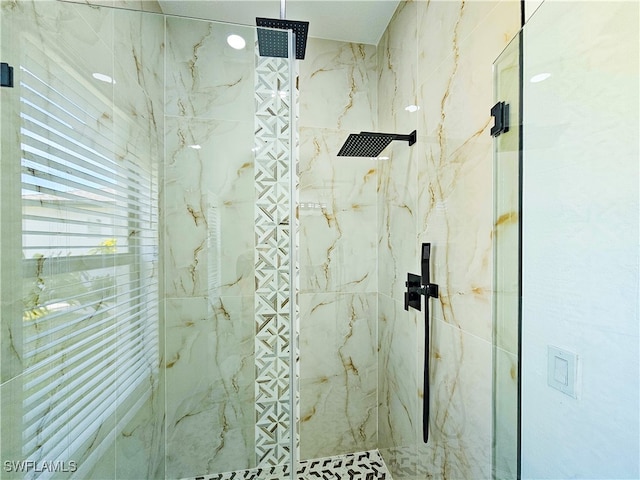 bathroom with a tile shower