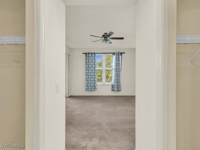 carpeted empty room with ceiling fan