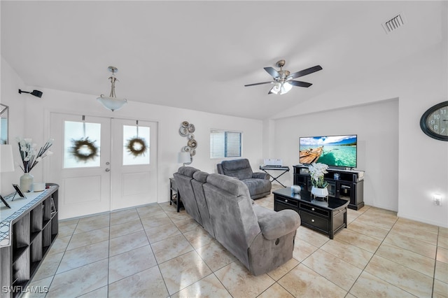 tiled living room with ceiling fan, lofted ceiling, and a healthy amount of sunlight