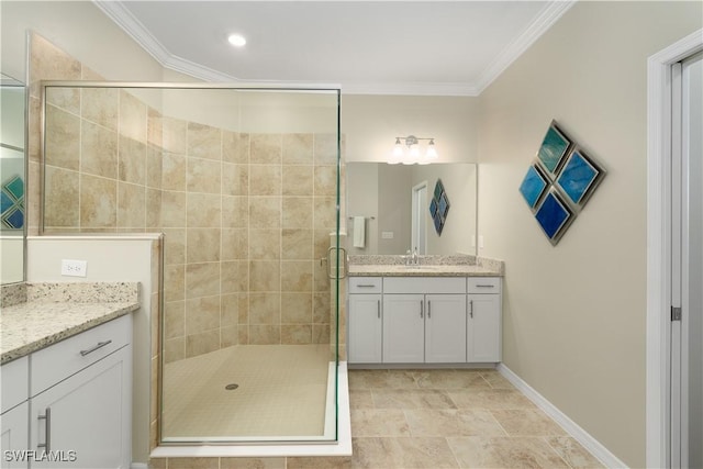 bathroom with vanity, a shower with door, and crown molding