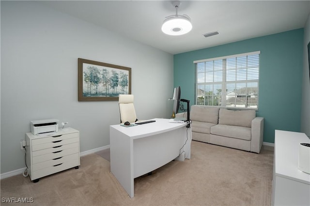 office with light carpet, baseboards, and visible vents