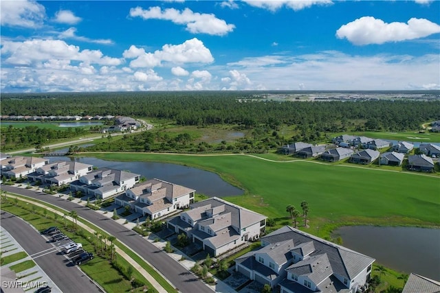 drone / aerial view with a residential view and a water view