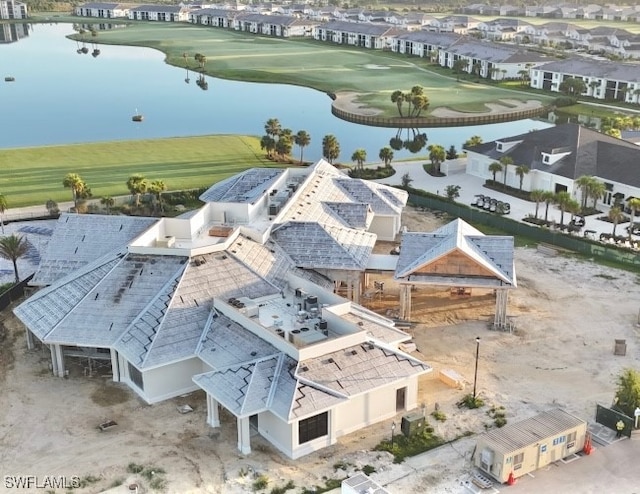 aerial view with a water view and golf course view