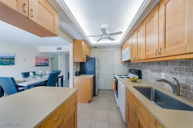 kitchen featuring tasteful backsplash, ornamental molding, light tile patterned flooring, sink, and white appliances