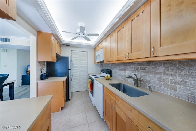 kitchen featuring white appliances, ornamental molding, sink, and decorative backsplash